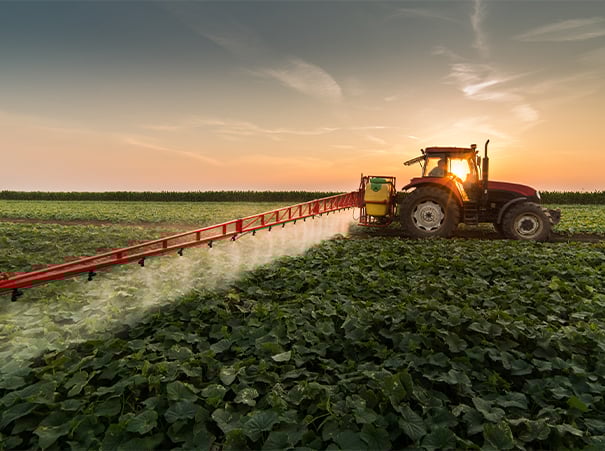 Tractor spraying pesticides
